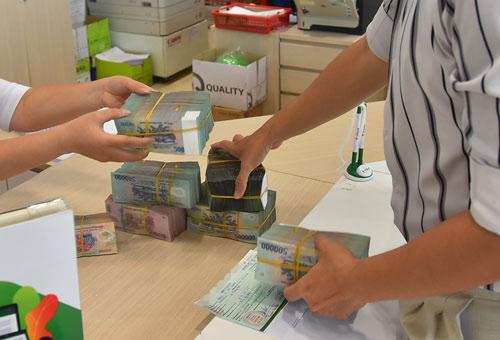 Ngân hàng khó bán nợ xấu - Ảnh 1. Ngân hàng khó bán nợ xấu - Ảnh 1.