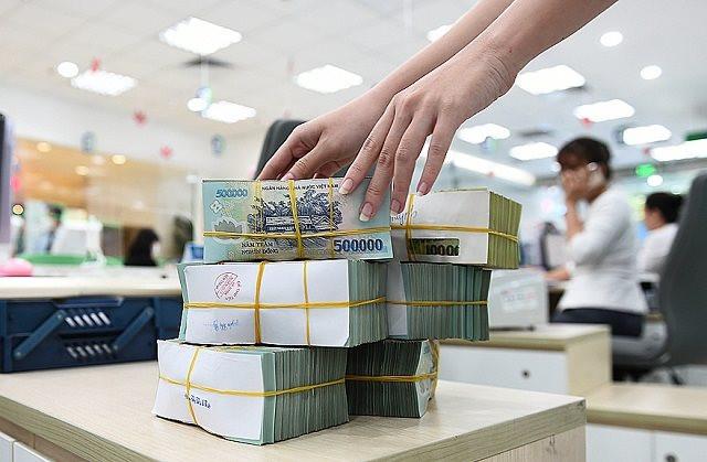 Toàn cảnh ngành ngân hàng quý I: Lợi nhuận lần đầu sụt giảm sau nhiều năm, nợ xấu tăng mạnh, bộ đệm dự phòng mỏng đi - Ảnh 1. Toàn cảnh ngành ngân hàng quý I: Lợi nhuận lần đầu sụt giảm sau nhiều năm, nợ xấu tăng mạnh, bộ đệm dự phòng mỏng đi - Ảnh 1.